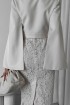 Cape with flared sleeves, with a belt at the waist