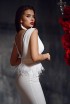 Dress with open back and a belt from feathers