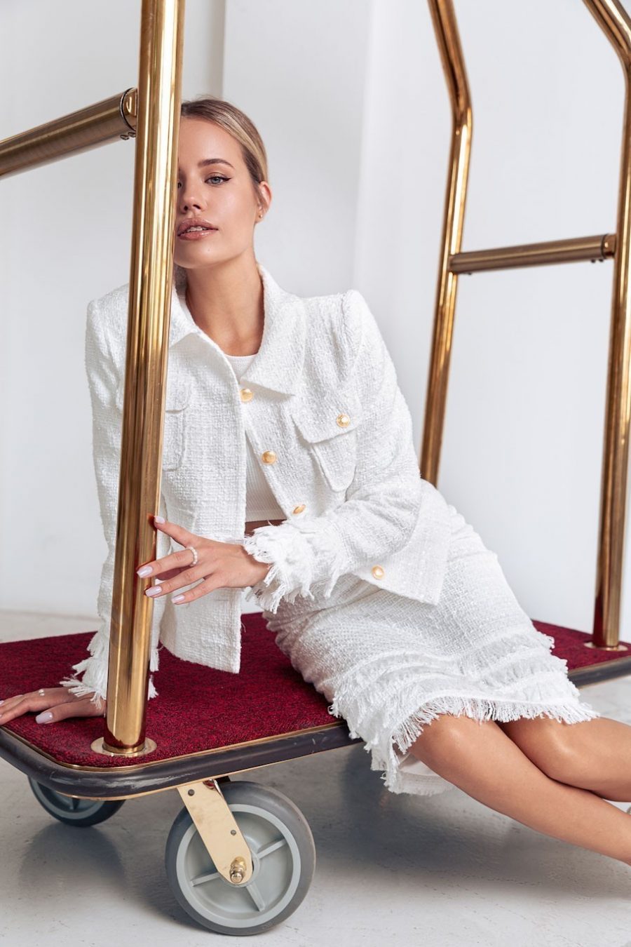 Tweed suit with fringed pockets with skirt
