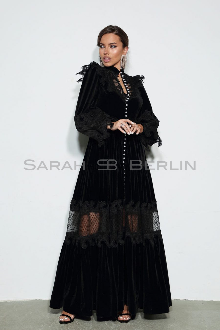 Floor-length velvet dress with lace mesh and wings