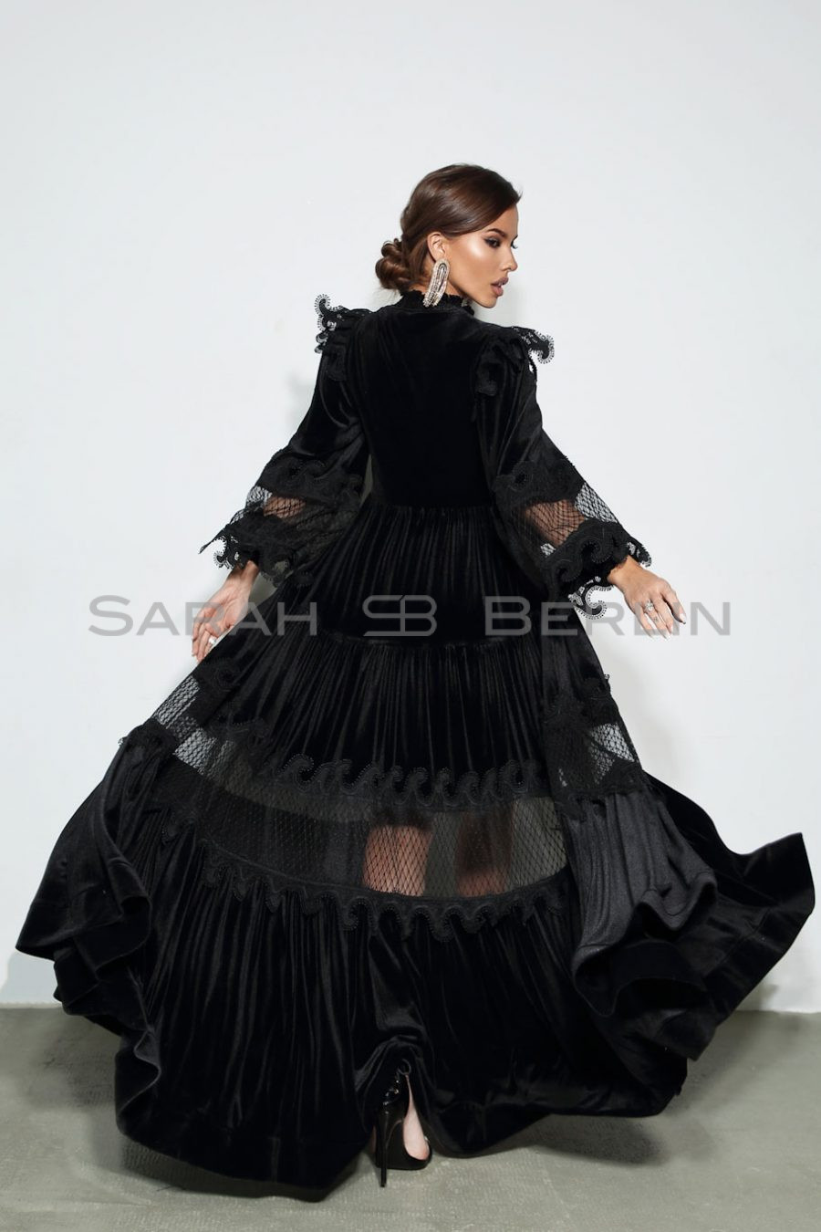 Floor-length velvet dress with lace mesh and wings
