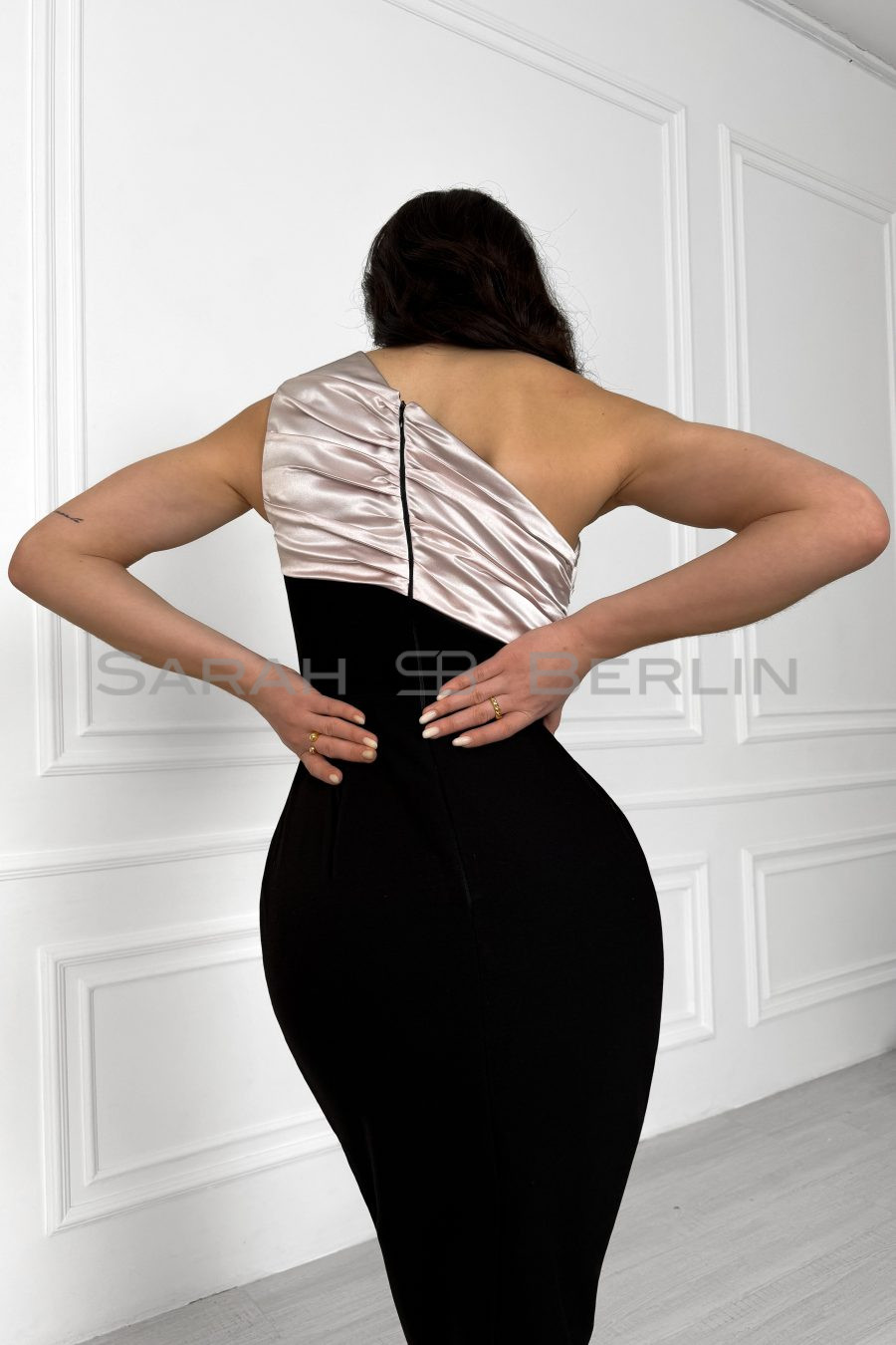 Black silhouette dress on one shoulder, with contrasting decor and Rose