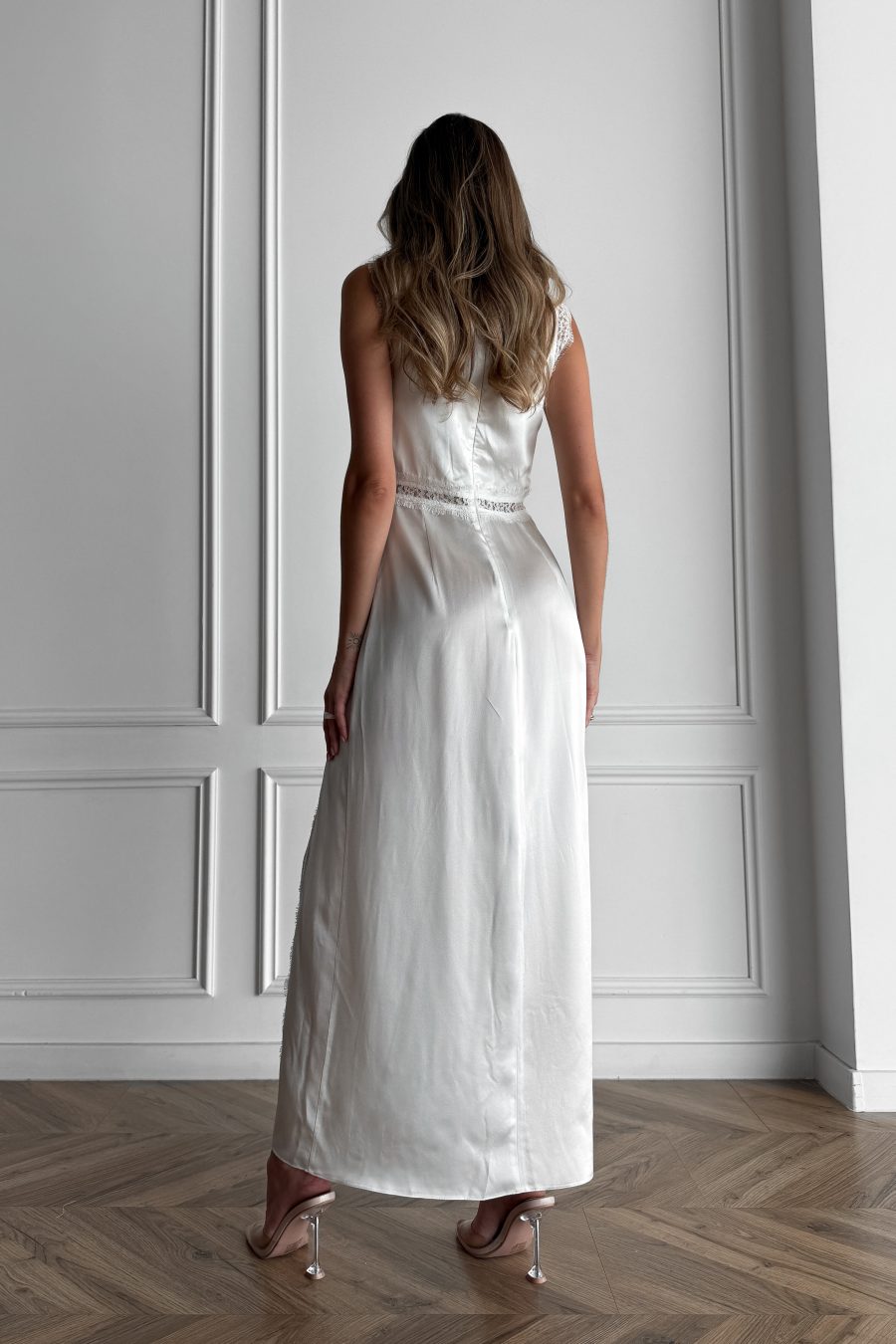 Long dress in lingerie style made of natural silk, with a slit on the leg, with lace