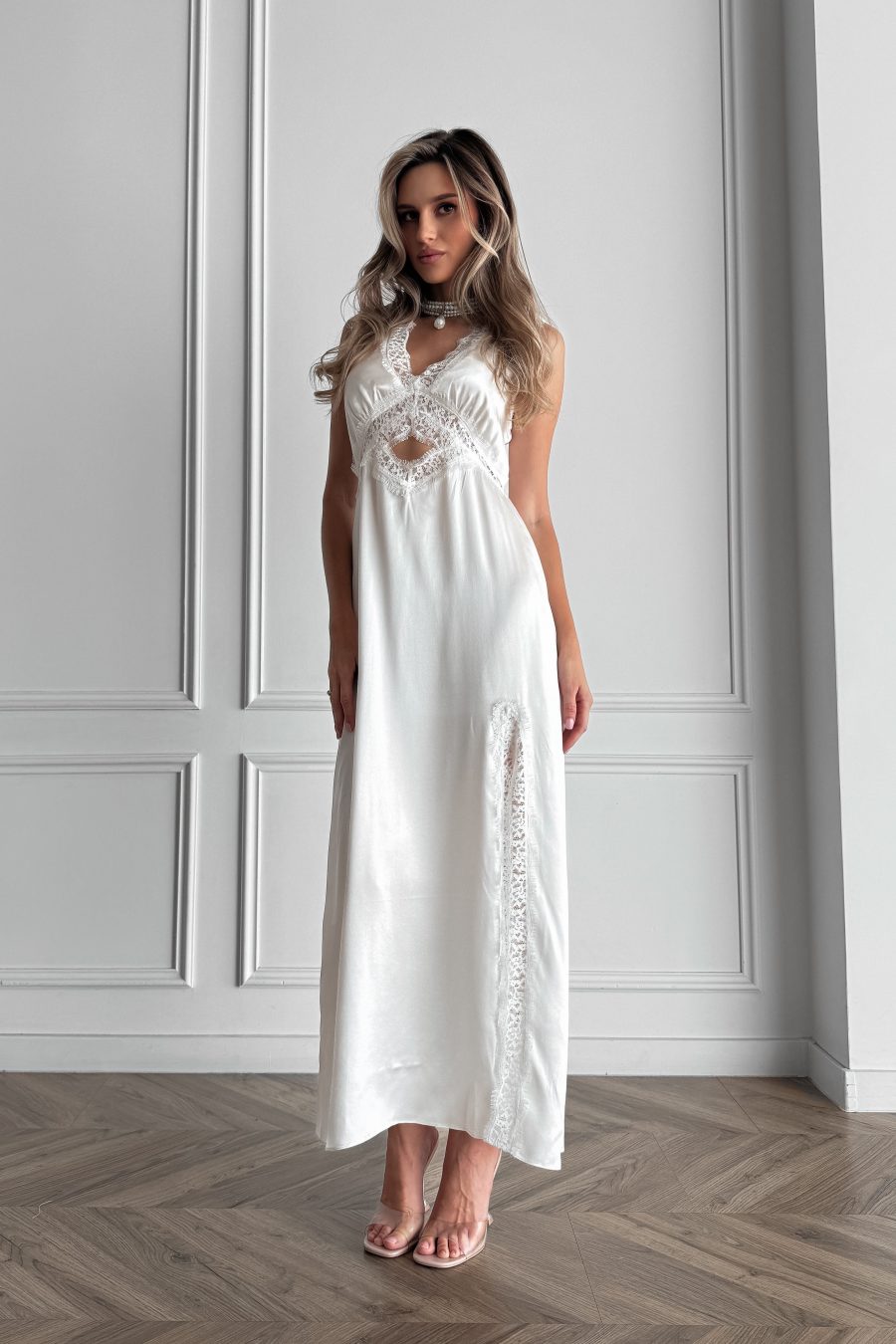 Long dress in lingerie style made of natural silk, with a slit on the leg, with lace