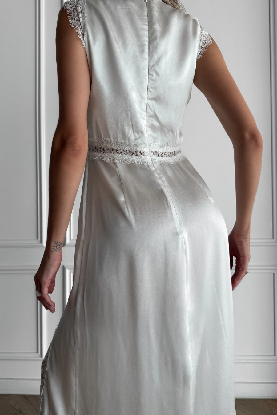 Long dress in lingerie style made of natural silk, with a slit on the leg, with lace