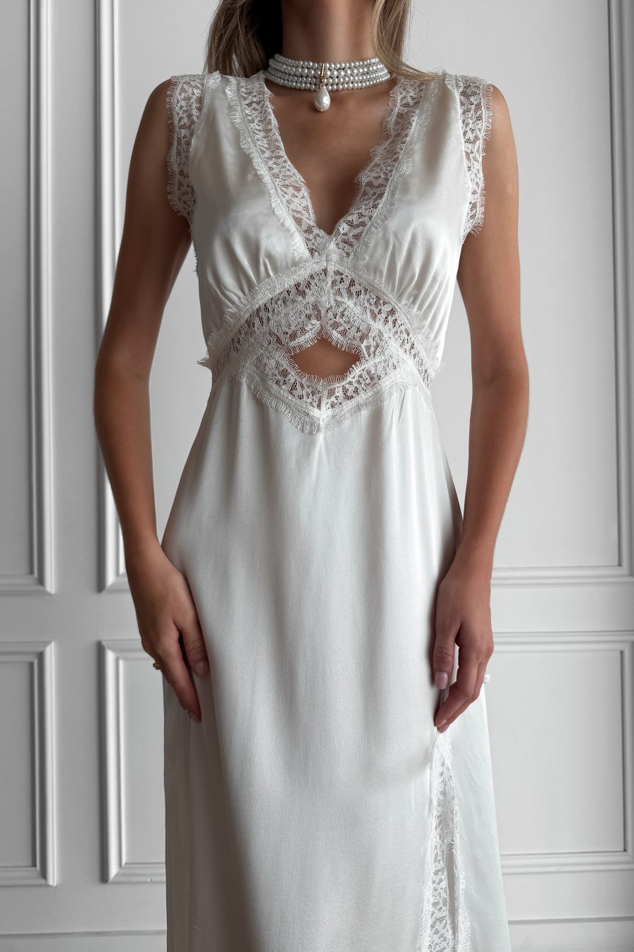 Long dress in lingerie style made of natural silk, with a slit on the leg, with lace